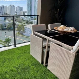 Artificial grass install at balcony dining area