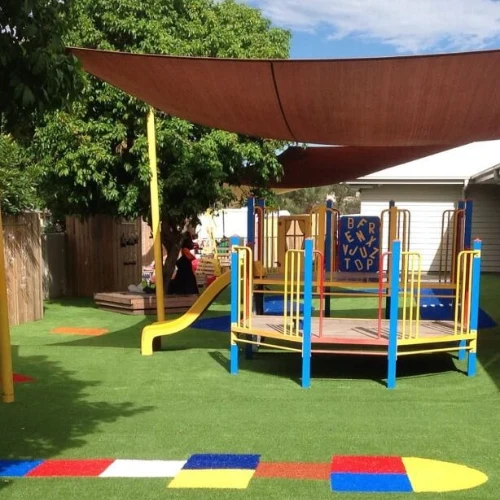 Playground turf around slides and swings