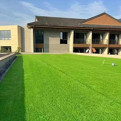 Hotel Poolside Artificial Grass fitting showing precise cuts around pool curves and walkways