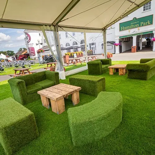 Hotel Poolside Artificial Grass installed around swimming pools with clean turf edges and drainage