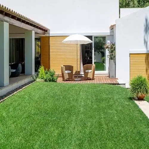 Hotel Poolside Artificial Grass used in resort leisure areas with organized green landscaping