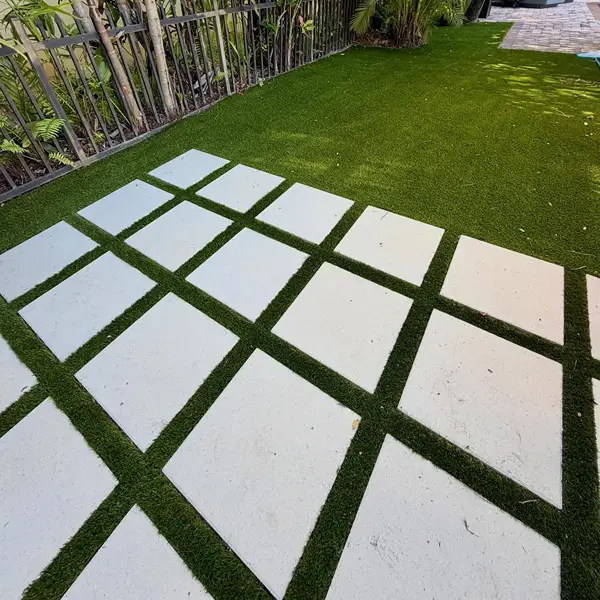 Artificial turf lawn with integrated stepping stones in Al Quoz