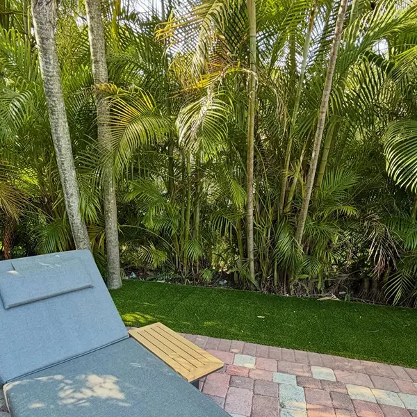 Artificial grass installation beside poolside seating in Al Quoz