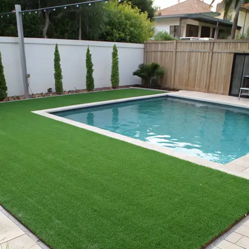 Artificial grass installation around a residential swimming pool in Arabian Ranches