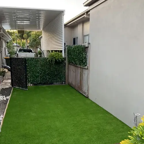 Artificial grass installation in a villa side yard in Arabian Ranches